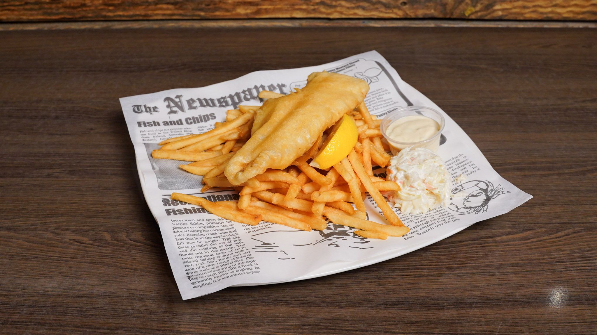 Beer-battered haddock and chips at Pump House Grille Co. — Old Credit amber beer batter with tangy slaw, Port Credit Mississauga