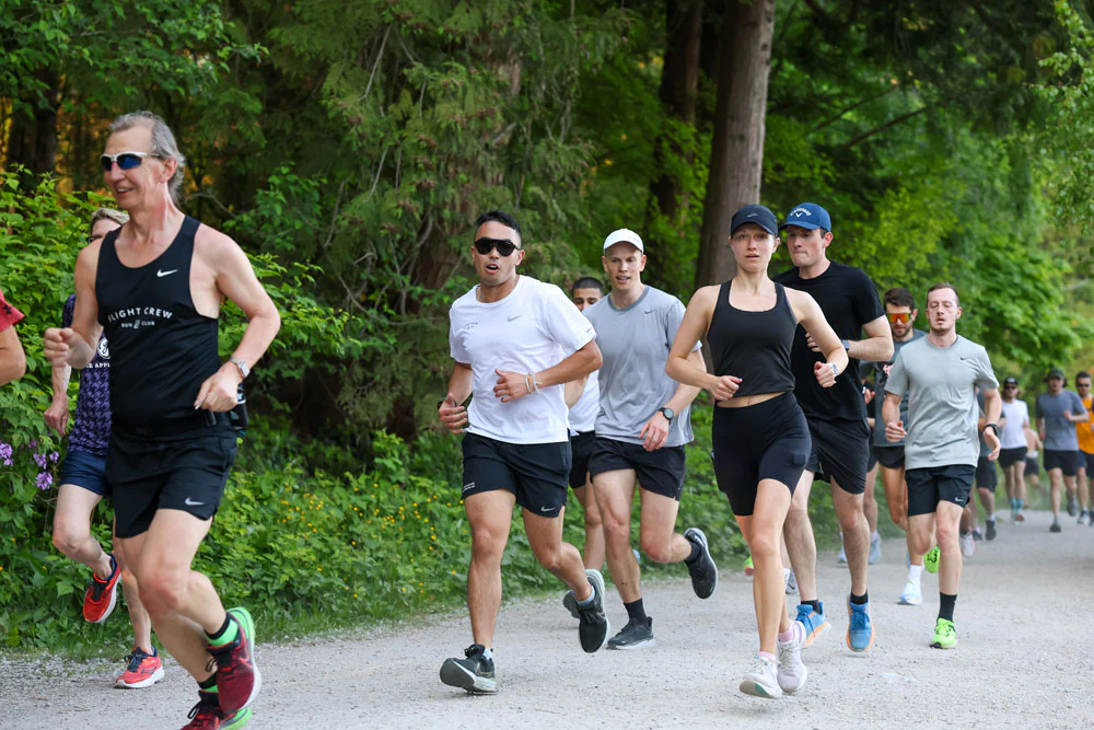 Pump House Run Club — group of runners along the waterfront at sunrise, Port Credit Mississauga. Every Saturday morning at 40 Lakeshore Rd E, all paces welcome.